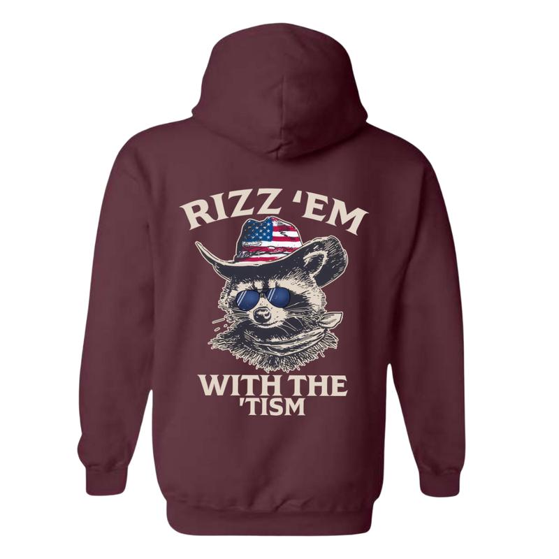 Rizz 'Em With The 'Tism Hoodie - Featuring a raccoon wearing an American cowboy hat and sunglasses, bringing a fun and unique style, perfect for outdoor parties and casual events, providing comfort and style. Unisex.